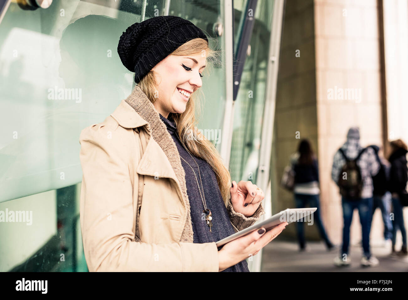 Blonde woman using a digital tablet Stock Photo
