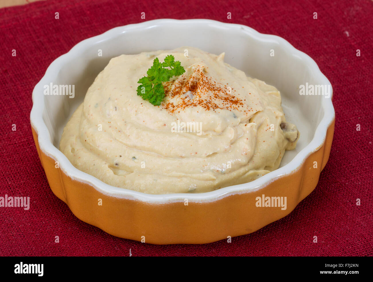 Hummus in the bowl with paprica and cedar nut Stock Photo Alamy
