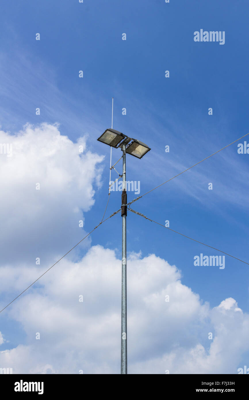 External floodlight with metal cables of connection and antenna. Stock Photo