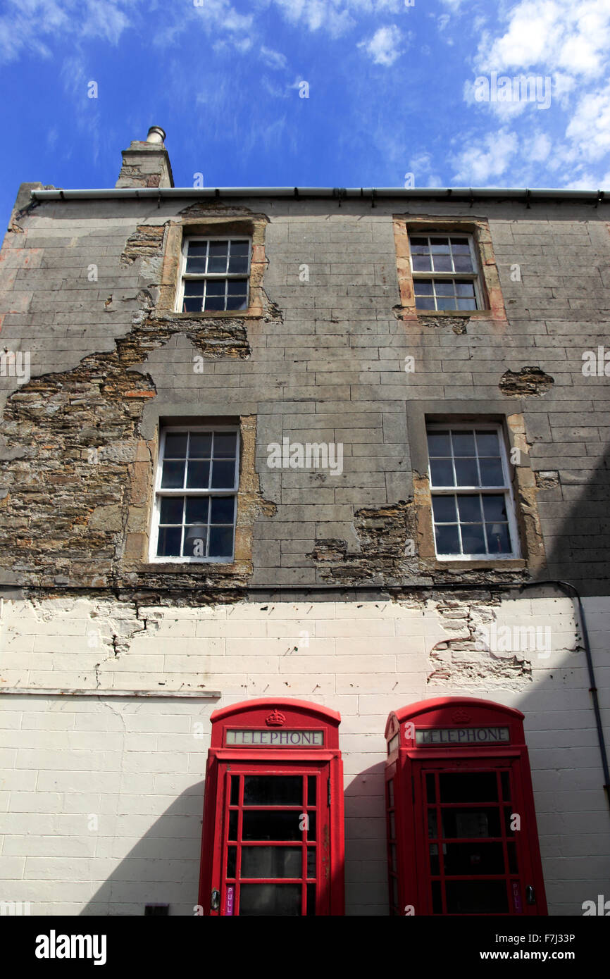 Red telephone boxes outside a building Kirkwall Orkney Islands Scotland UK Stock Photo