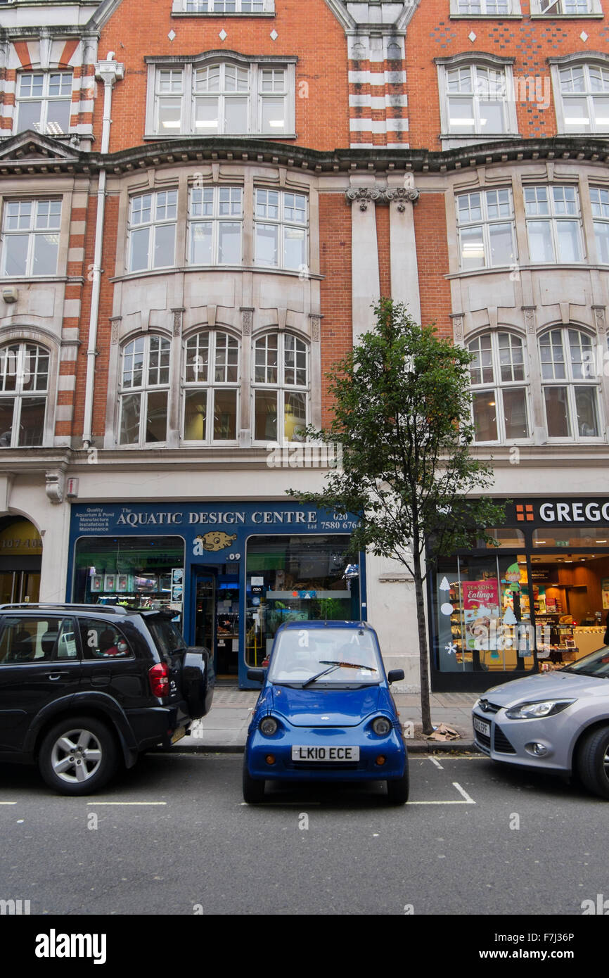 G-Wiz, a small micro electric car, parked sideways in Great Portland Street in London, England, UK Stock Photo