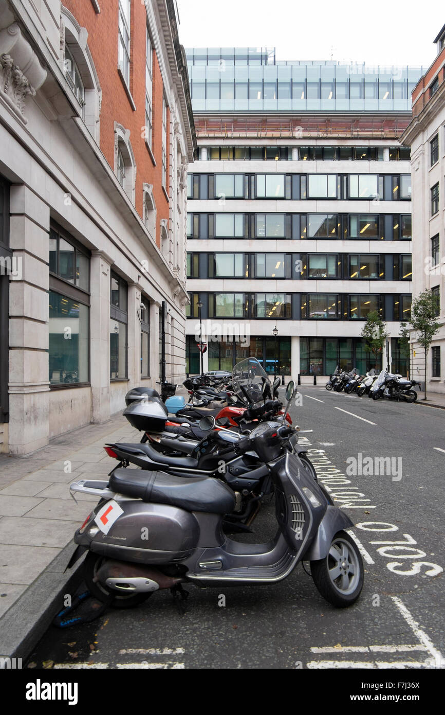 Scooters and motorbikes parked in a Solo Motorcycles bay in a side street near the BBC, London