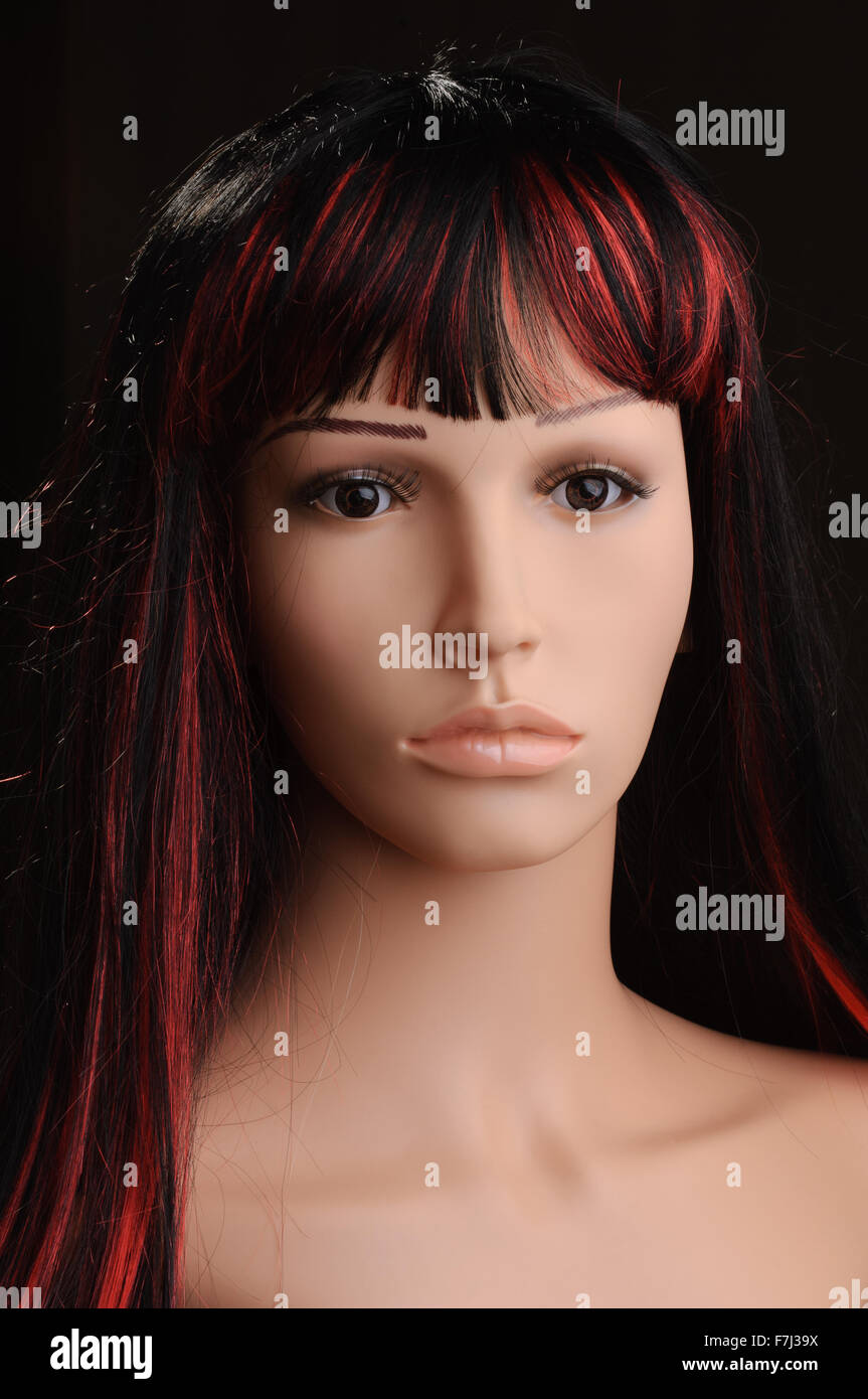 Low Key Studio Lit Female Mannequin With Black Hair And Red