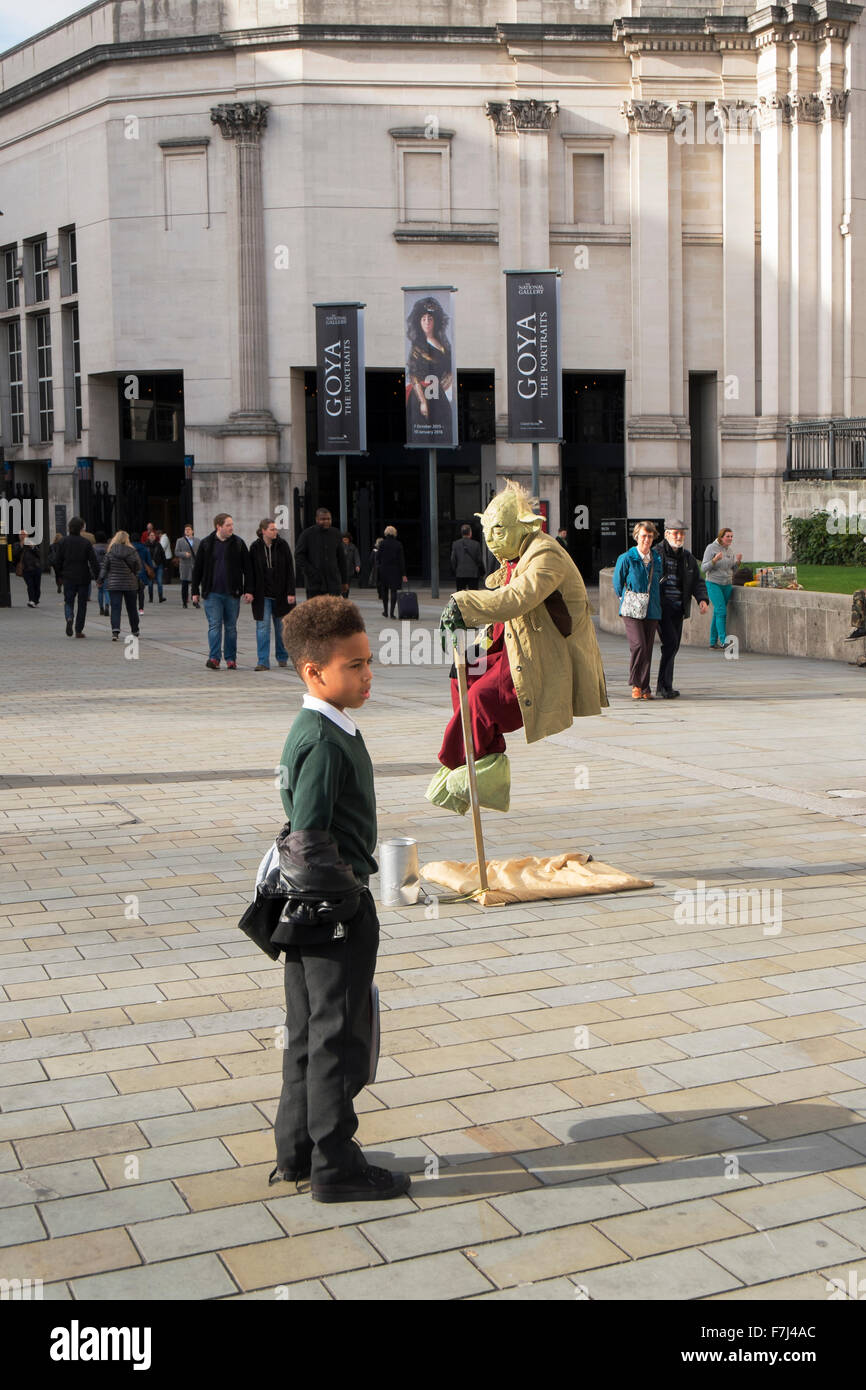 Yoda the Jedi Master from the Star Wars films, appearing to levitate in front of the National Gallery, London, England, UK Stock Photo
