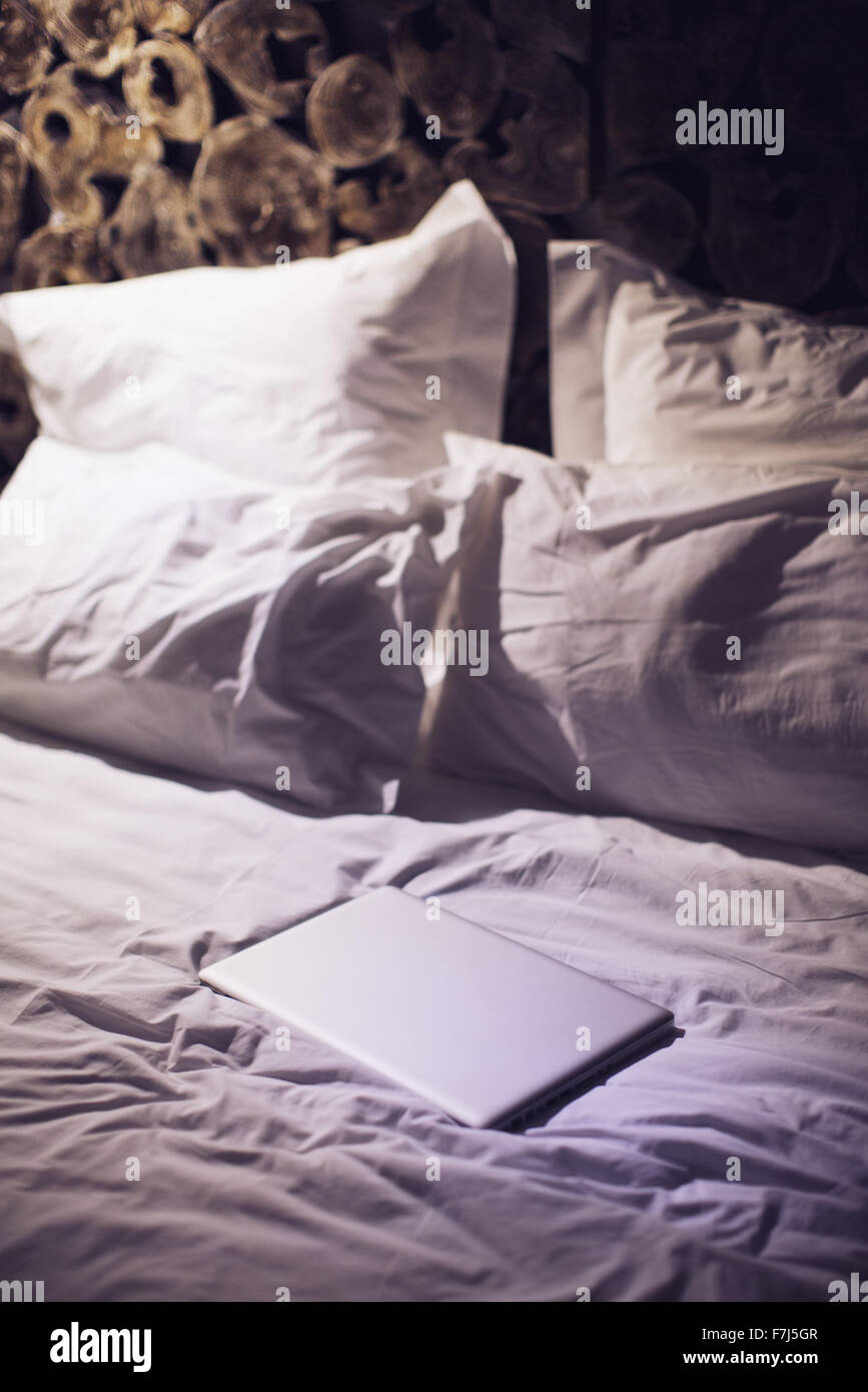 Laptop computer on bed Stock Photo Alamy