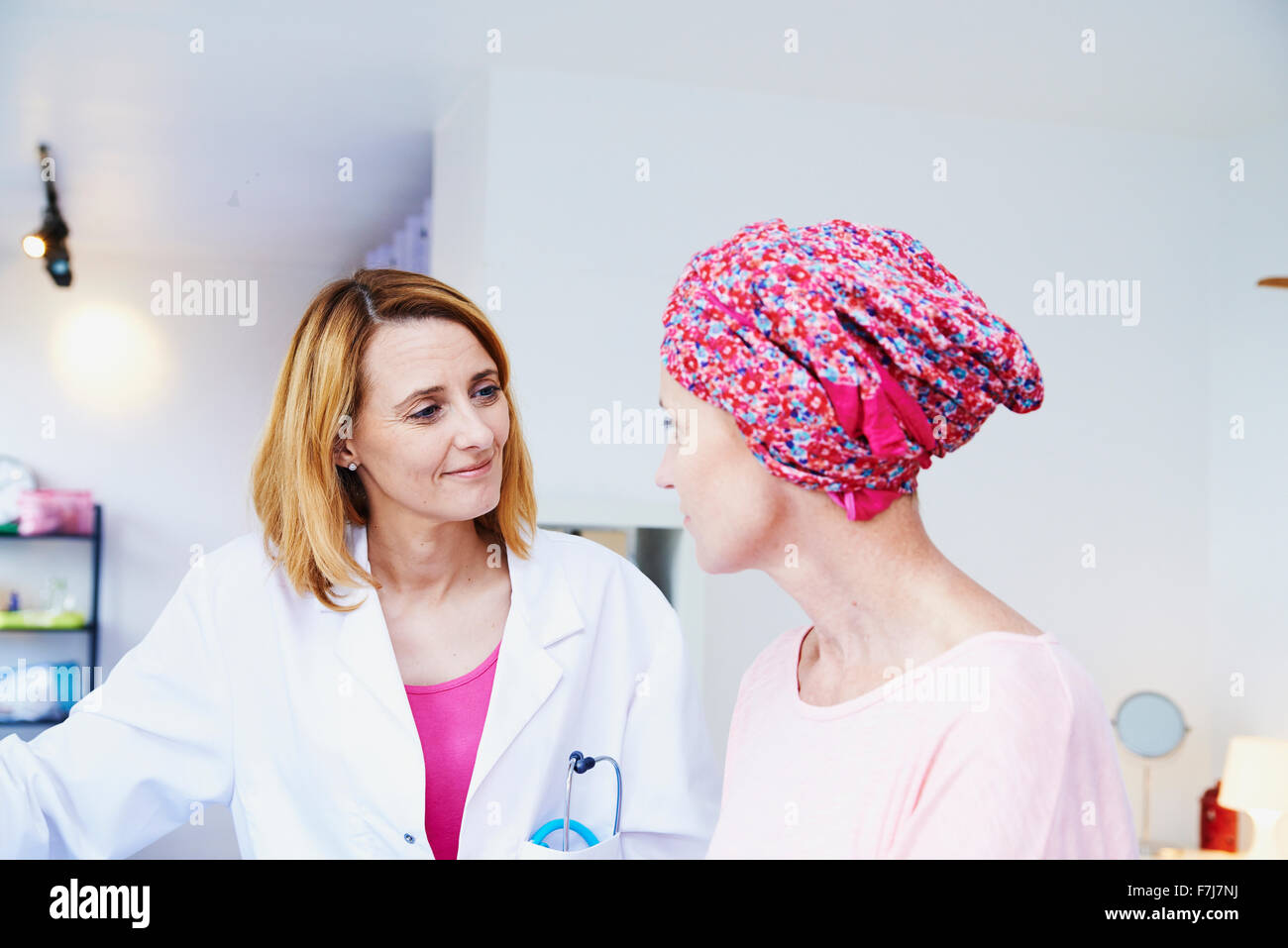 Discussing Cancer Doctor discussing cancer with elderly hi-res stock photography and ...