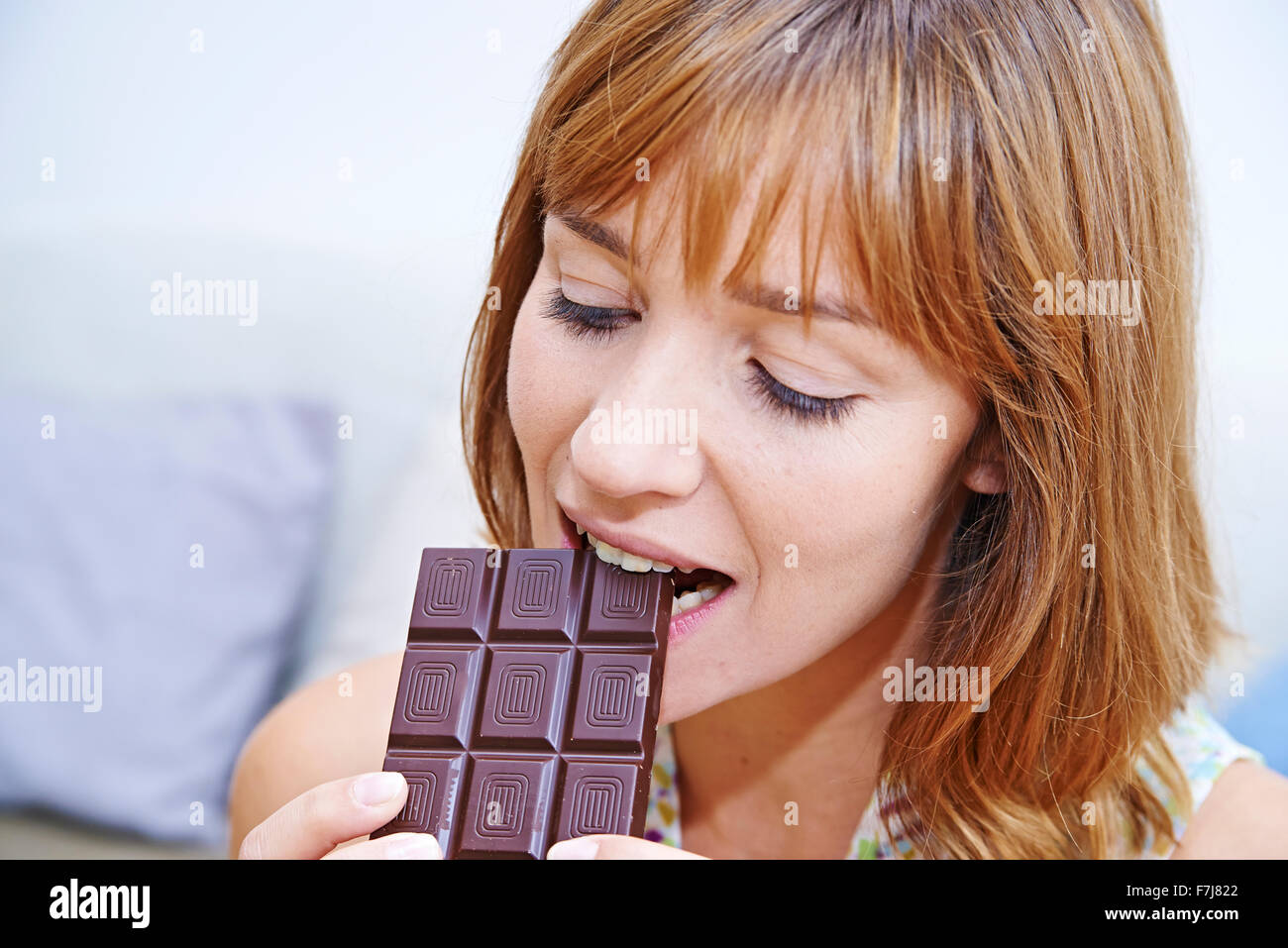 WOMAN EATING SWEETS Stock Photo