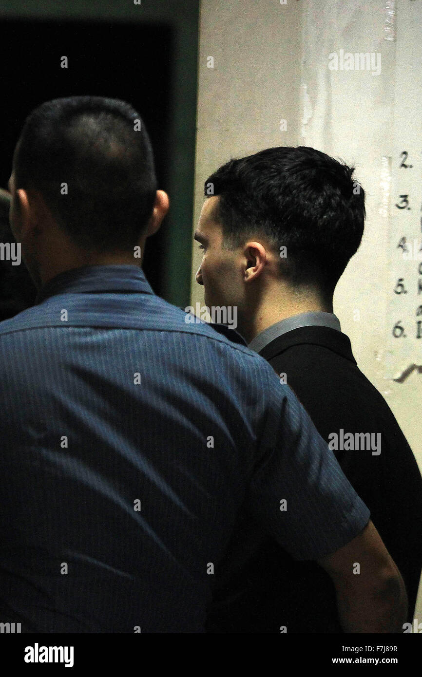 Olongapo City, Philippines. 1st Dec, 2015. U.S. Marine Lance Corporal Joseph Scott Pemberton (R) is escorted by security personnel before the verdict on a murder case at the Regional Trial Court in Olongapo City, the Philippines, Dec. 1, 2015. Pemberton is found guilty of homicide in the killing of Filipino transgender Jeffery 'Jennifer' Laude and will face a 6 to 12 years of imprisonment at the Armed Forces of the Philippines (AFP) Custodial Center. Credit:  Rouelle Umali/Xinhua/Alamy Live News Stock Photo