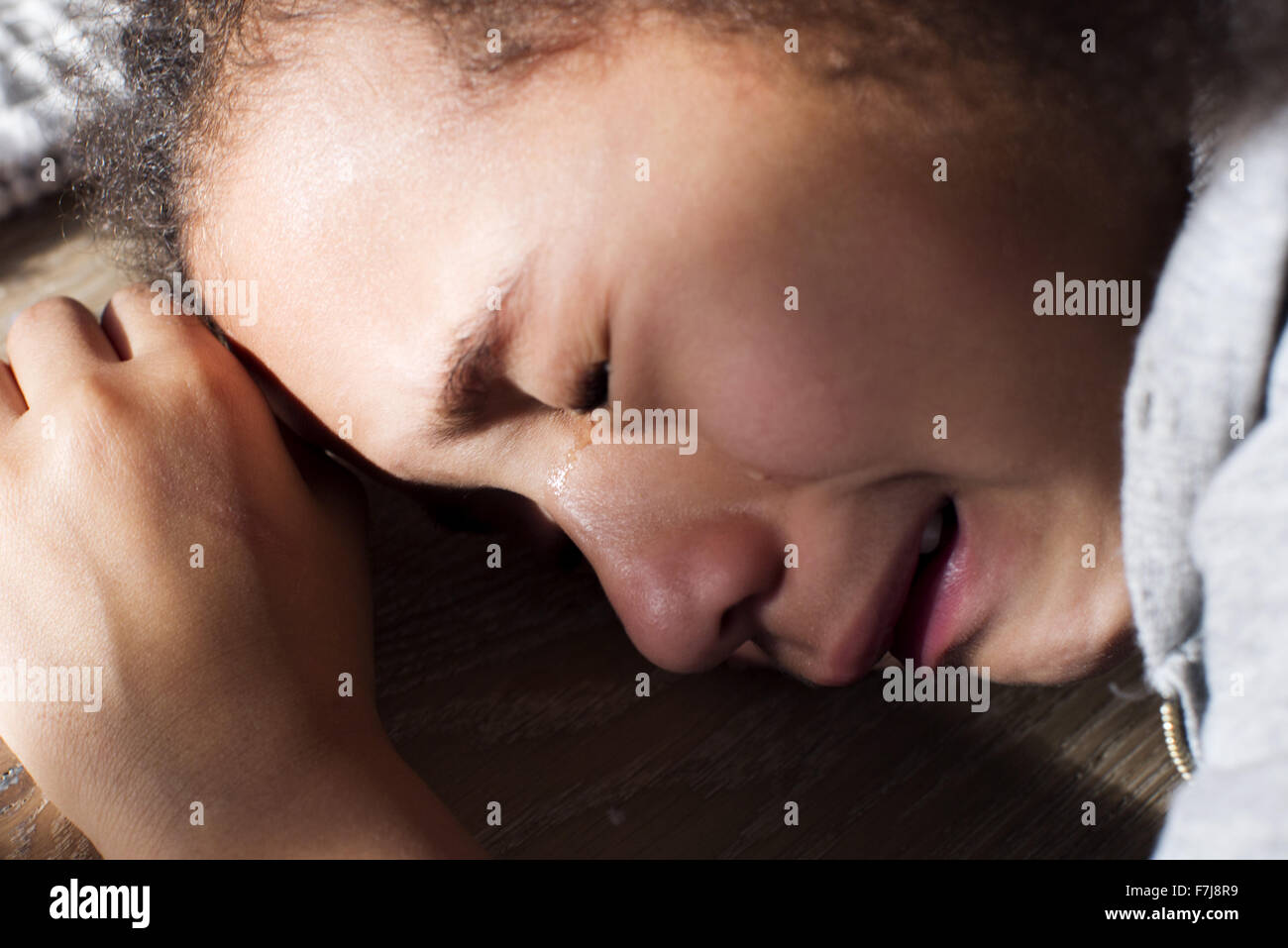 Girl crying, close-up Stock Photo