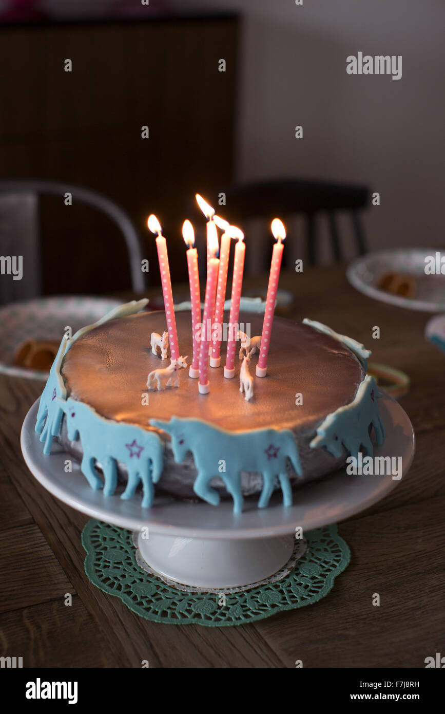 Birthday cake with lit candles Stock Photo - Alamy
