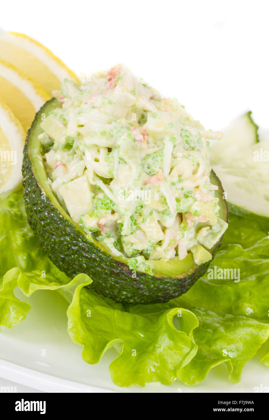 Crab meat salad with green caviar in avocado japan cusine Stock Photo
