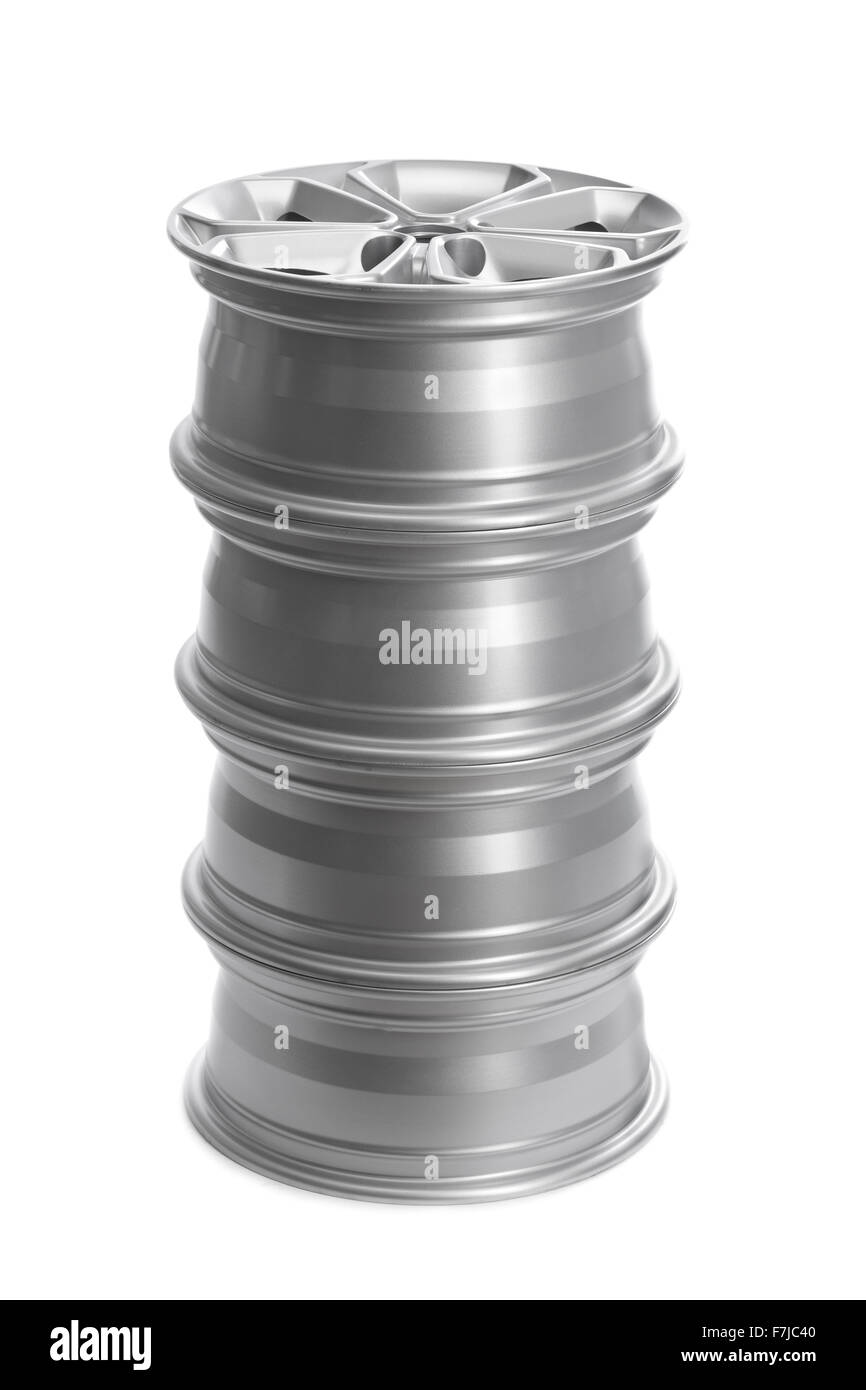 Set in a stack of steel alloy car rims on a white background. Stock Photo