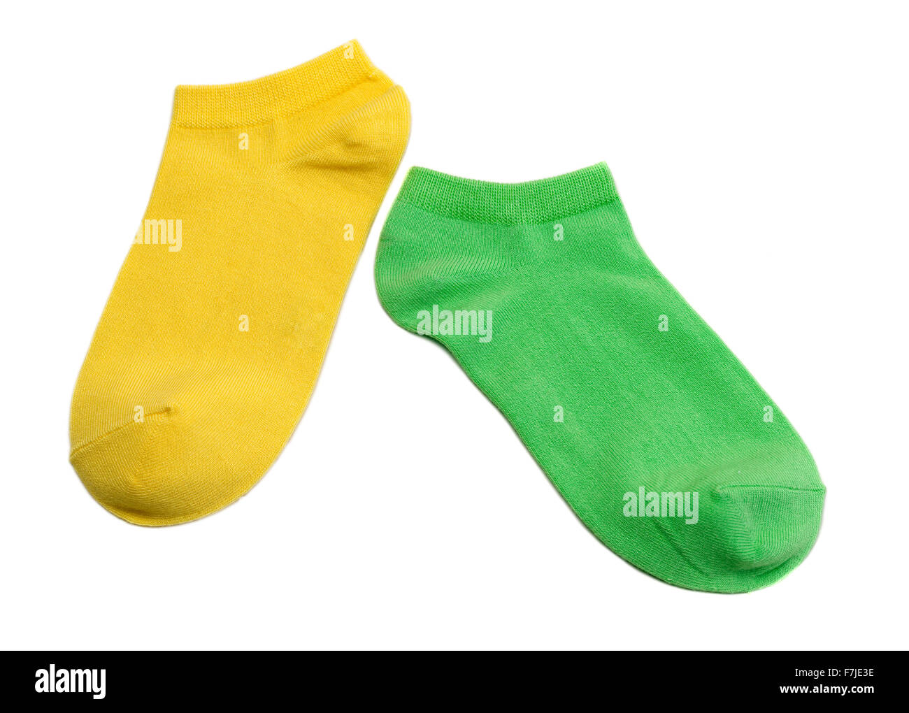 Two colored socks, yellow and green. Isolate on white. Stock Photo