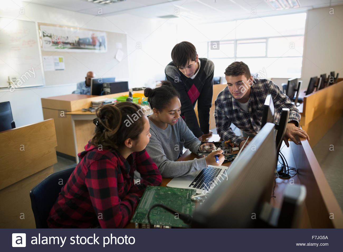 High school students examining electronics part computer science Stock Photo