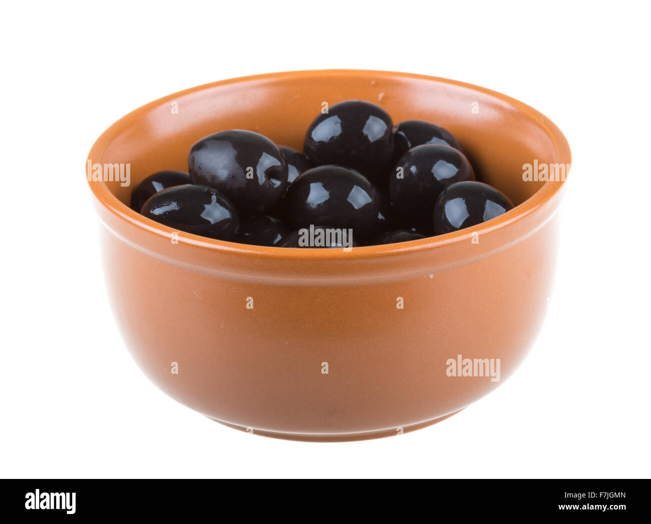 Olives black watered with olive oil in a bowl isolated on a white ...