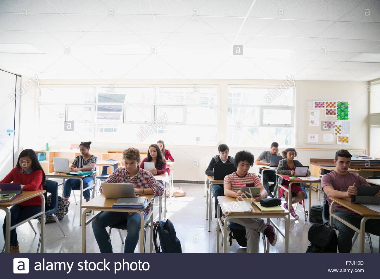 High school students digital tablets and laptops classroom Stock Photo