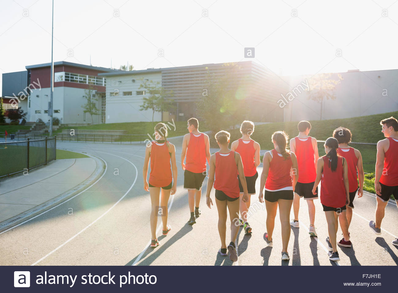 High school track and field team running track Stock Photo