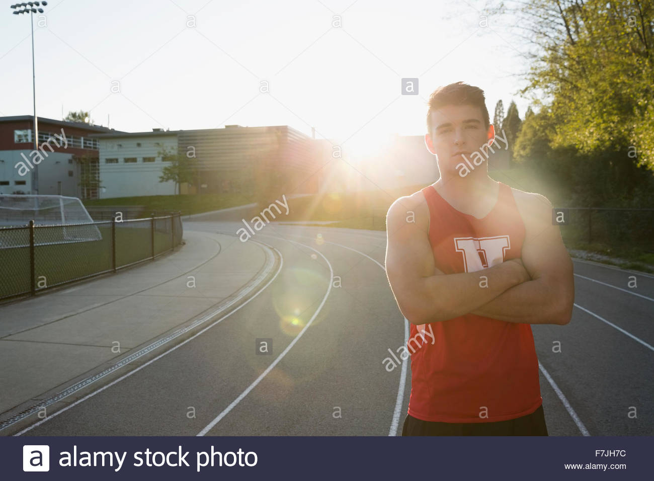 Portrait confident high school track and field athlete Stock Photo