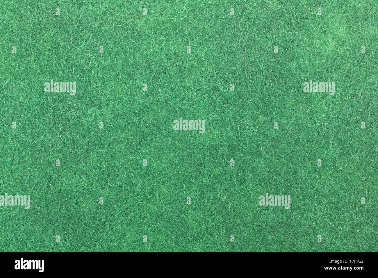 A very close view of the texture of a new green kitchen scrubber. Stock Photo