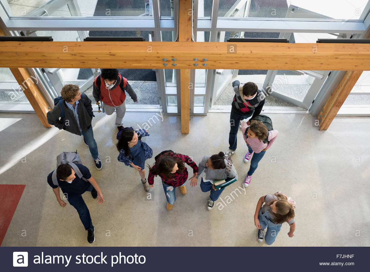 Overhead view high school students entering doors Stock Photo