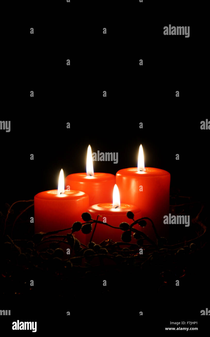 four red christmas candles Stock Photo