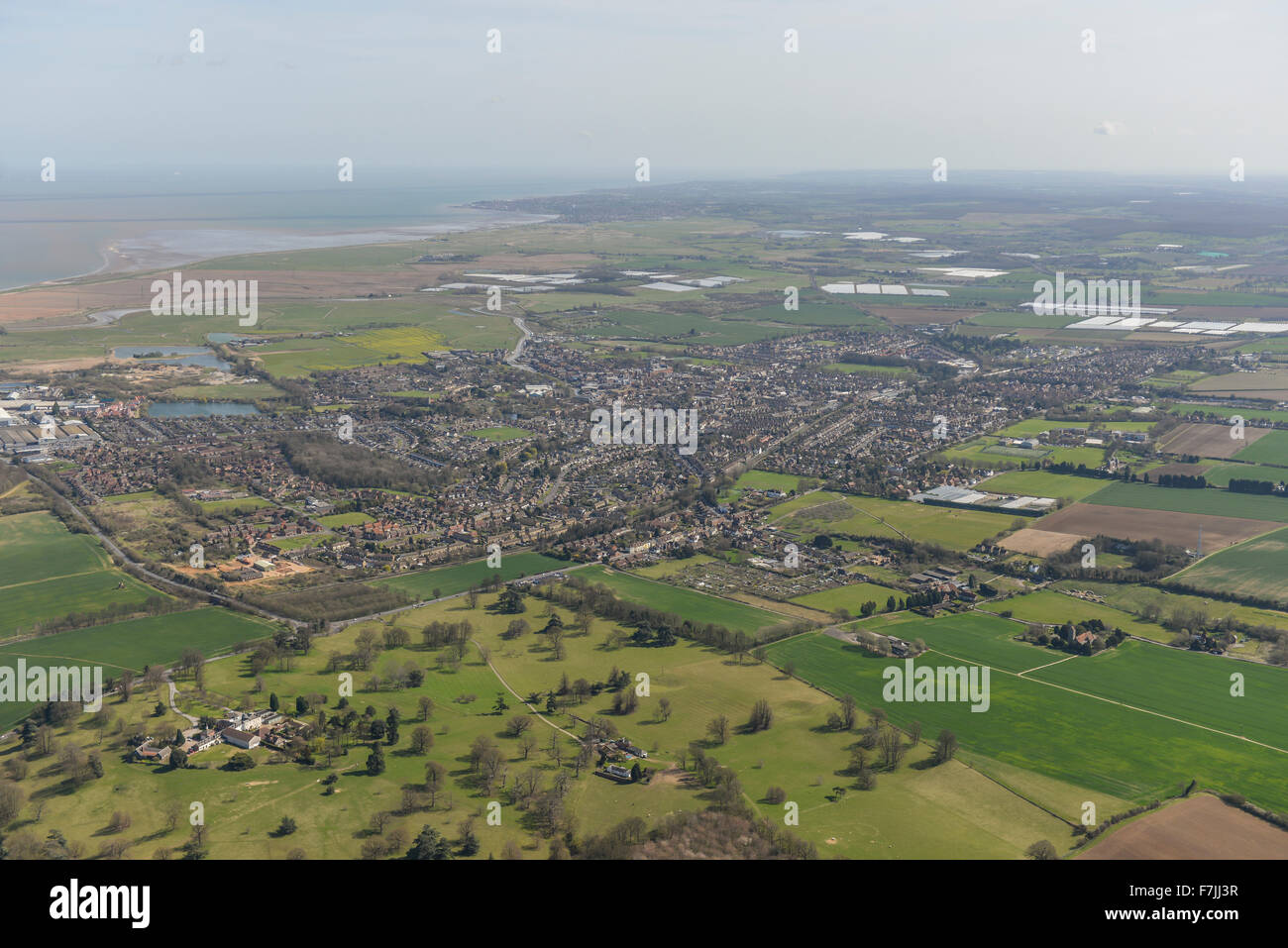A wide aerial view showing the Kent town of Faversham and surrounding ...