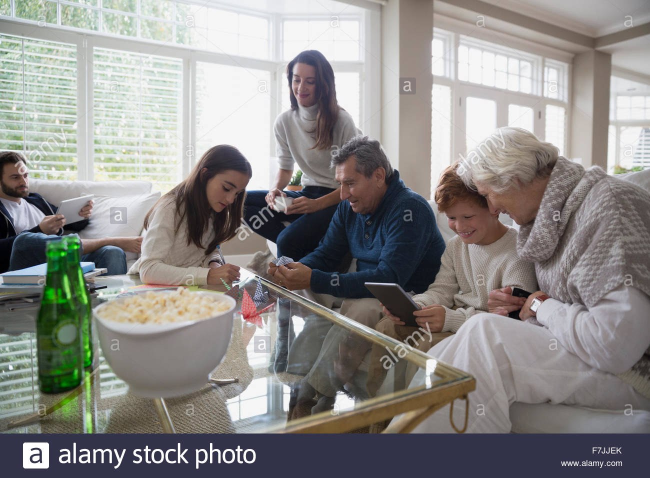 Multi-generation family hanging out in living room Stock Photo