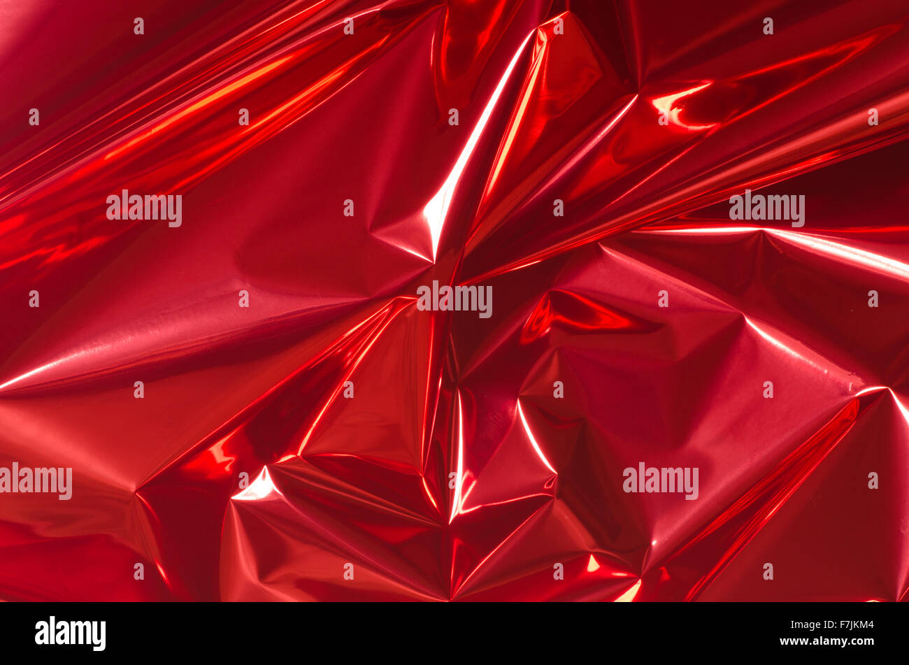 red shiny metallic foil background Stock Photo - Alamy