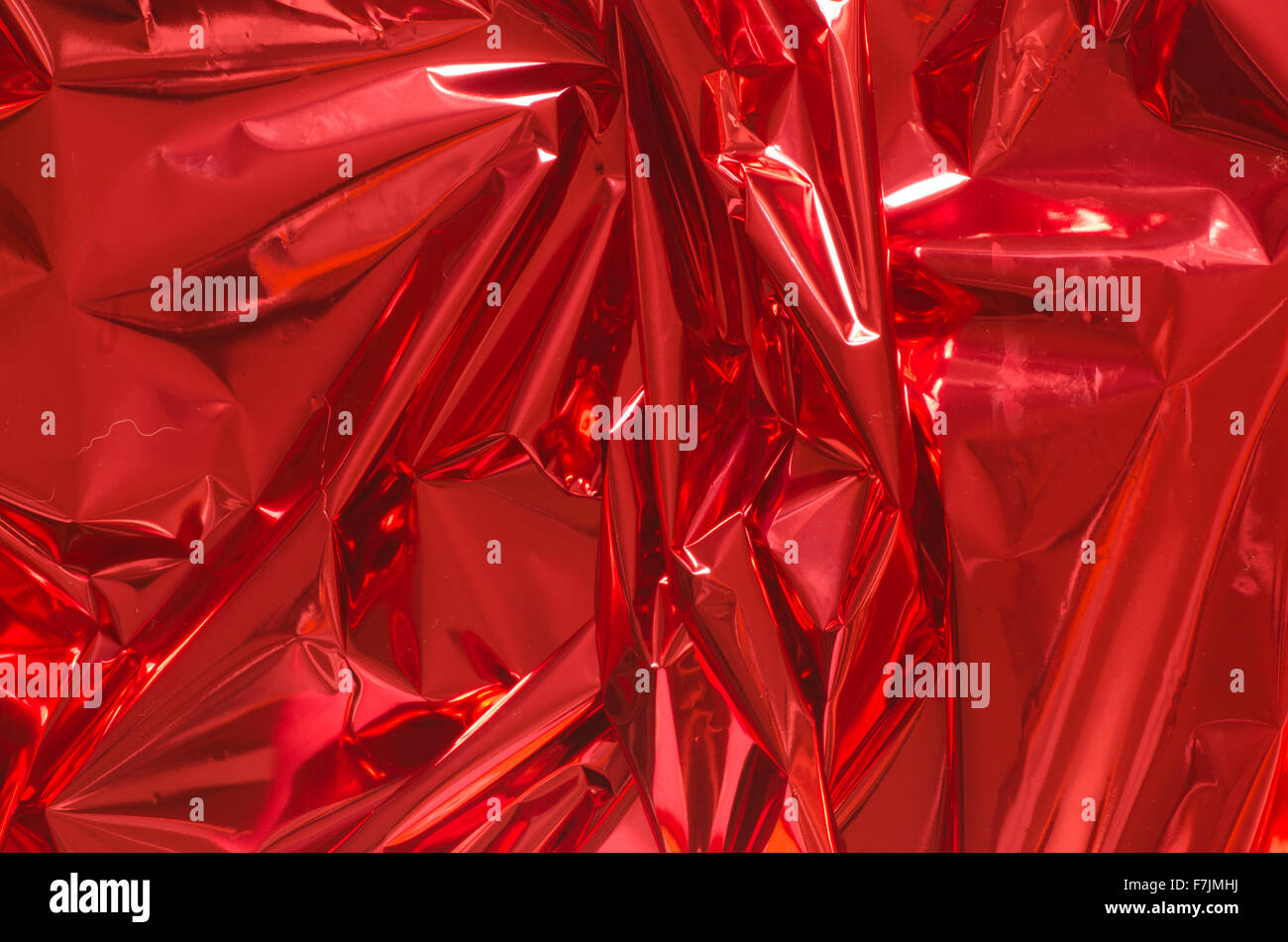 red shiny metallic foil background Stock Photo