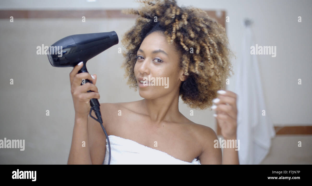 Woman Drying Her Hair With Hairdryer Stock Photo - Alamy