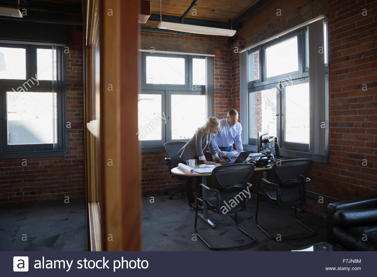Business people working at office desk Stock Photo
