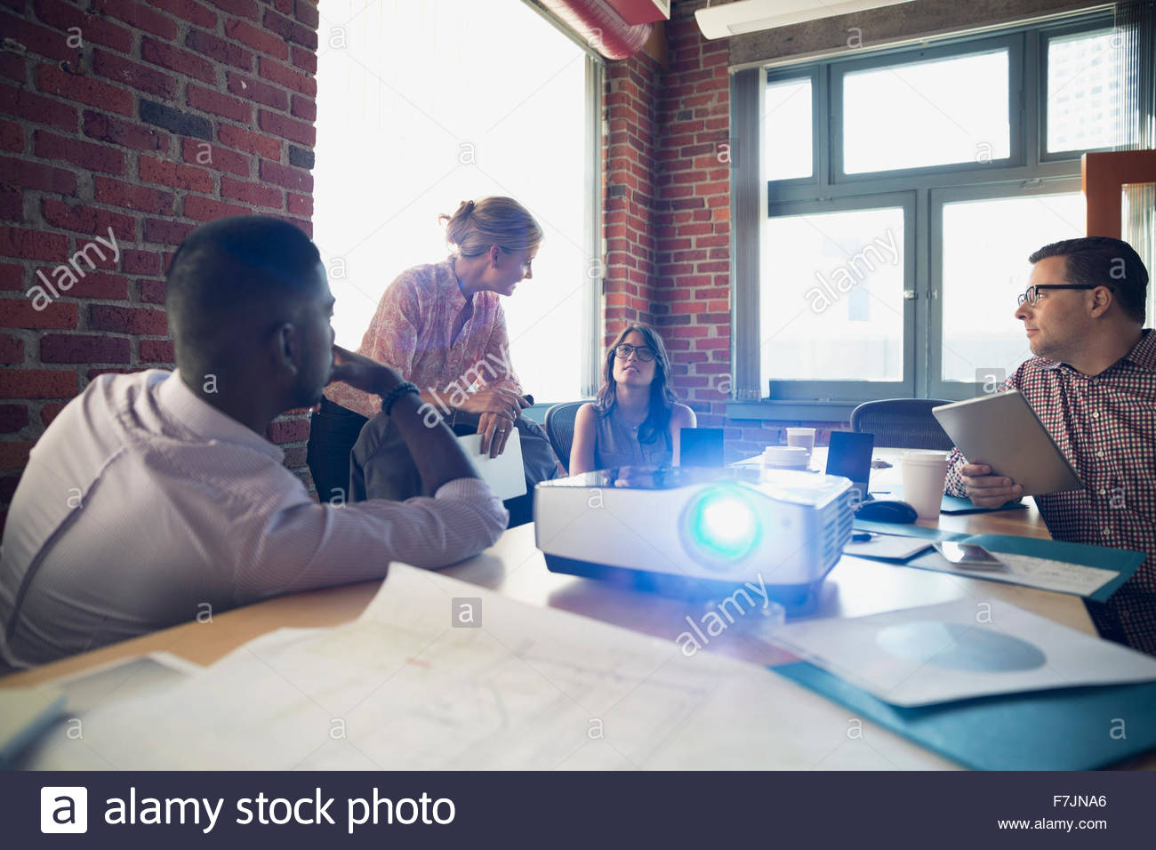 Business people meeting in conference room with projector Stock Photo