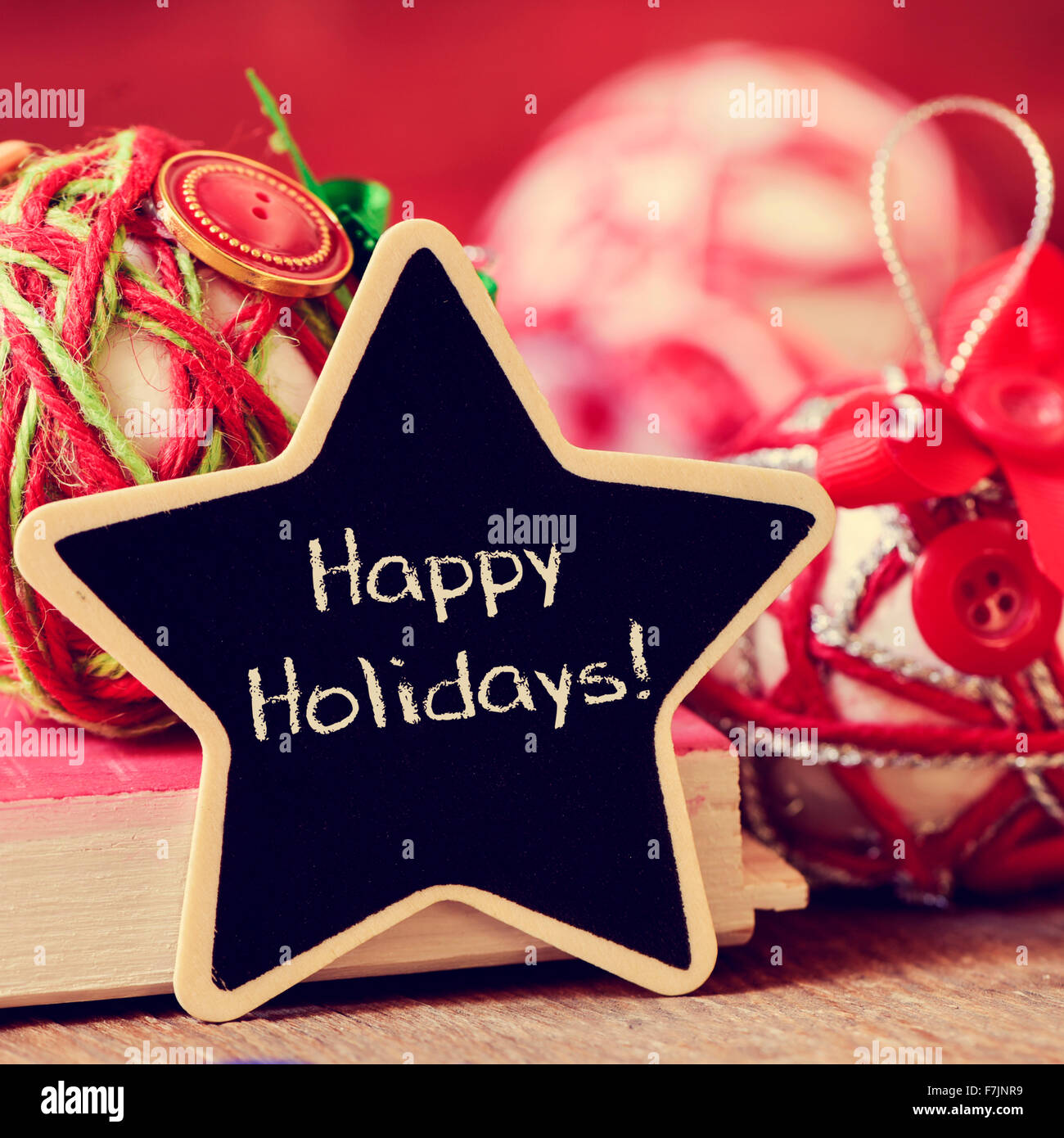 star-shaped chalkboard with the text happy holidays and some different