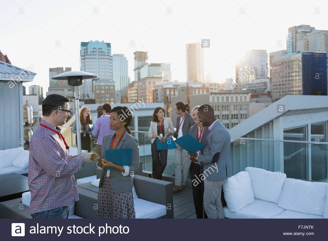 Business people networking on urban rooftop Stock Photo Alamy