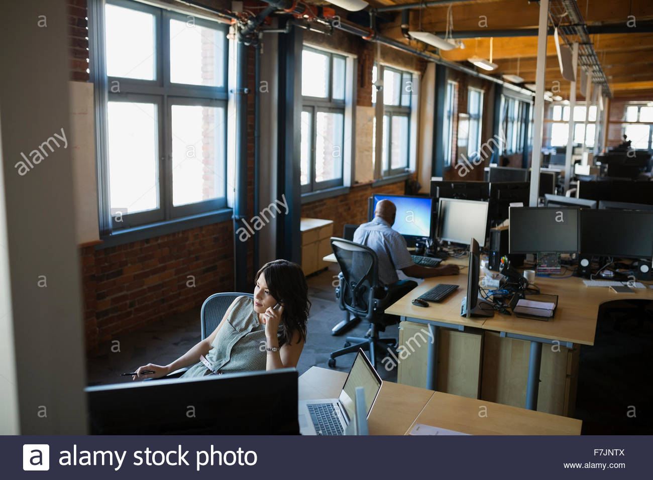 Business people working at desks in open office Stock Photo Alamy