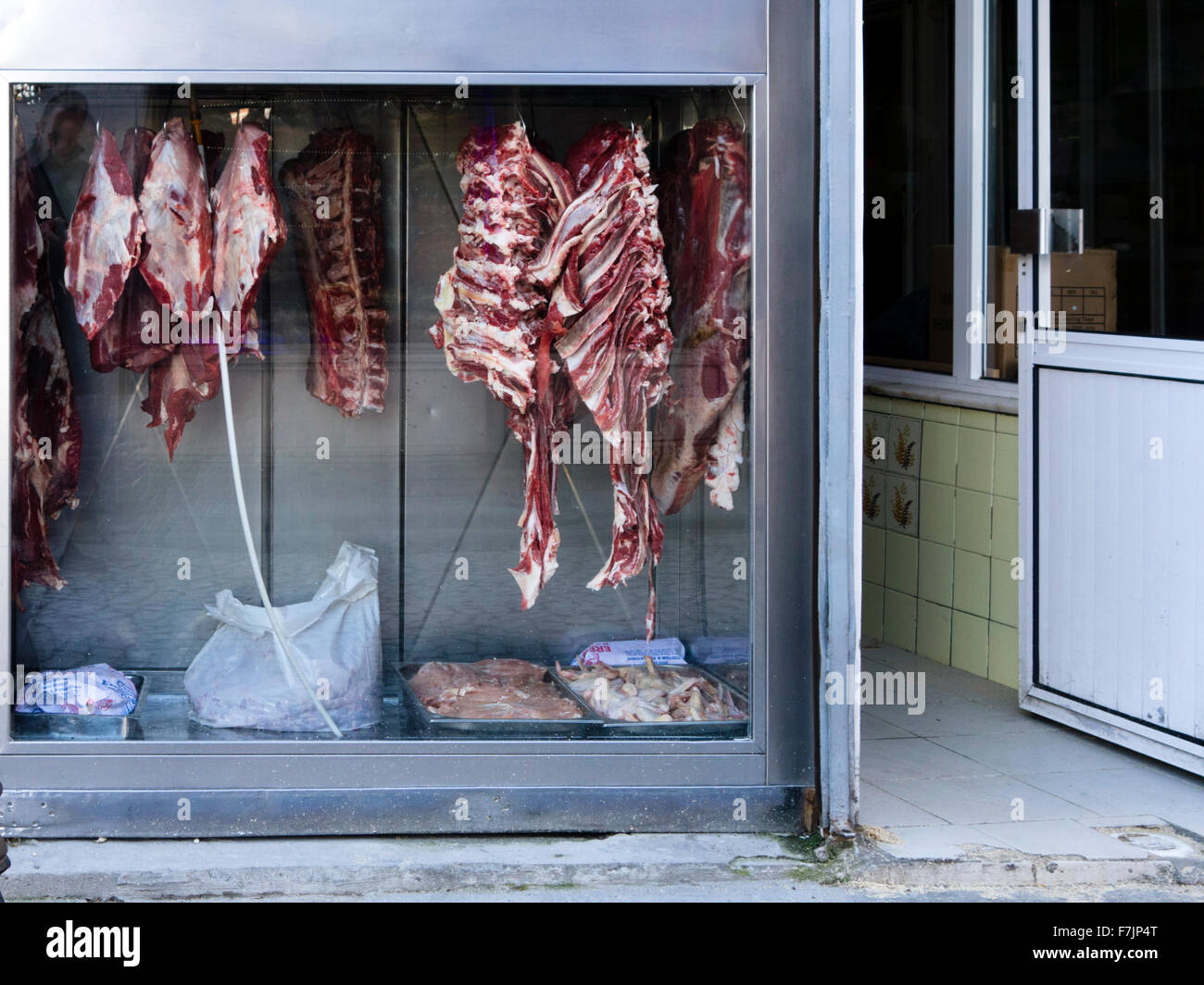 Meat hanging in the window of a butcher shop in Istanbul, Turkey Stock