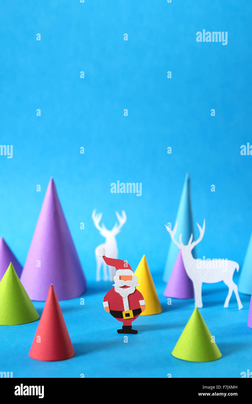 Christmas colorful paper craft scene with santa, deer silhouettes and ...