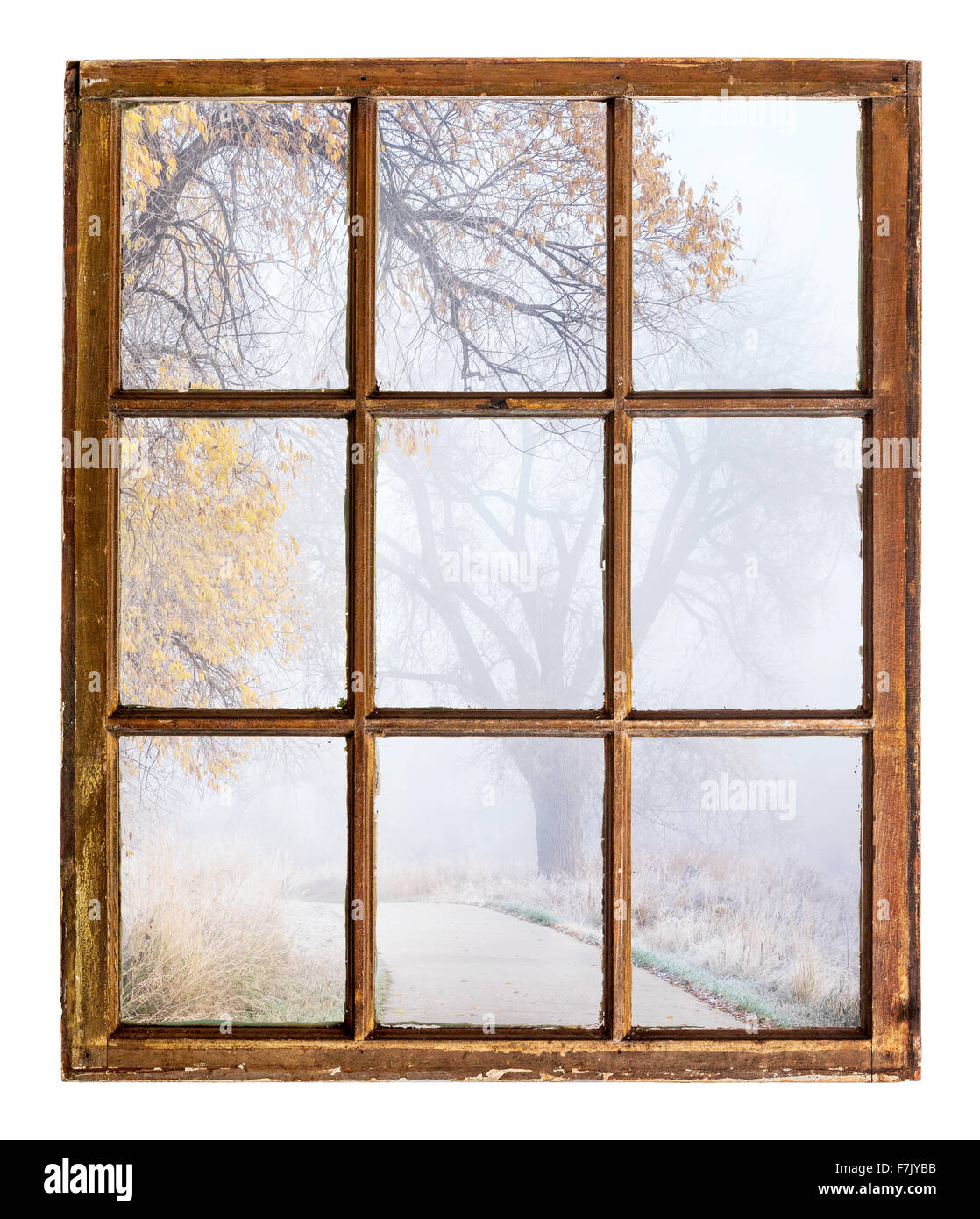 nostalgic autumn scene, foggy park trail - an abstract view from a vintage sash window Stock Photo