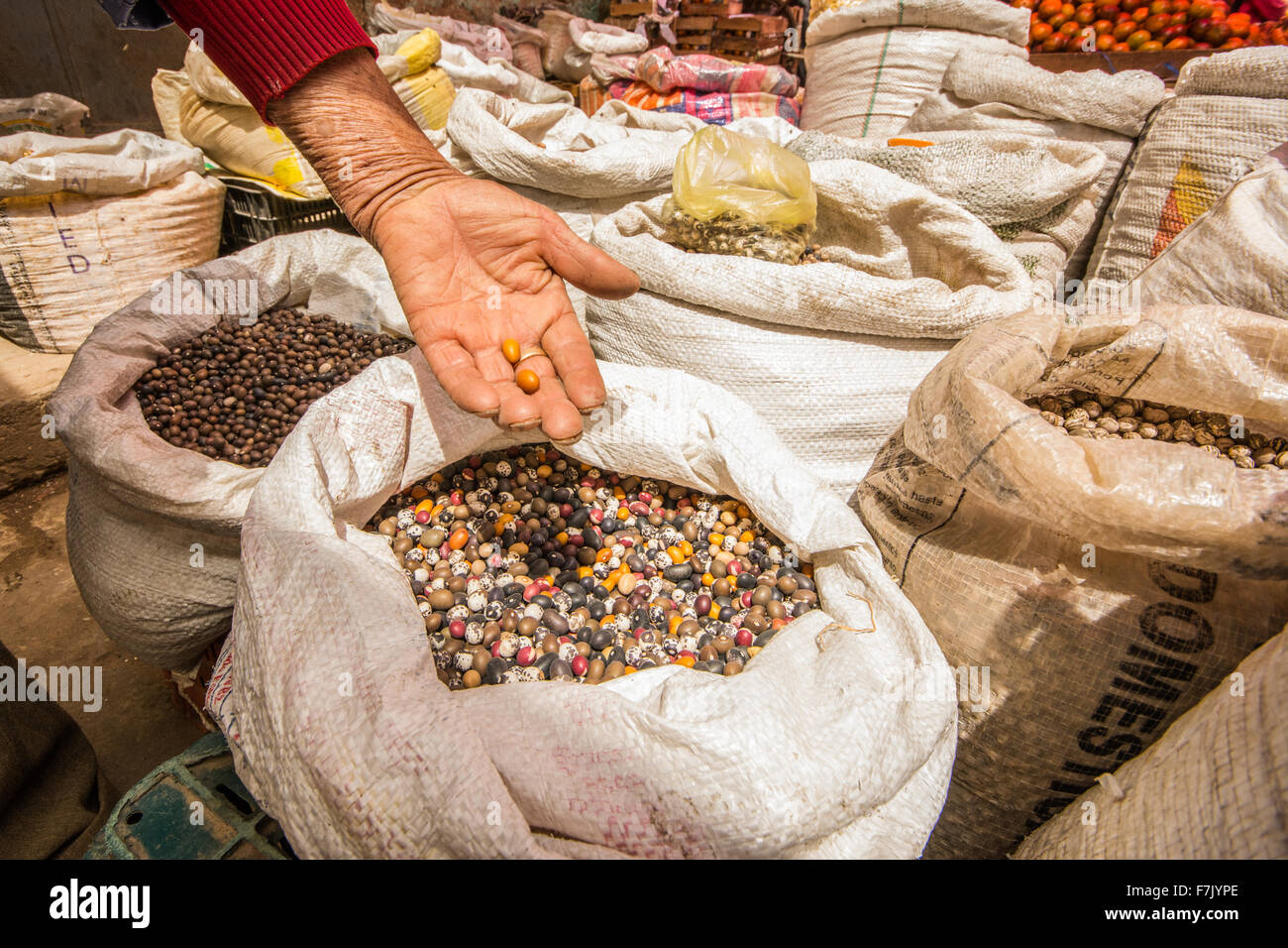 Various types of multi-colored beans, pulse and grains on sale at street market in town of Cajabamba in Cajamarca region of Peru Stock Photo