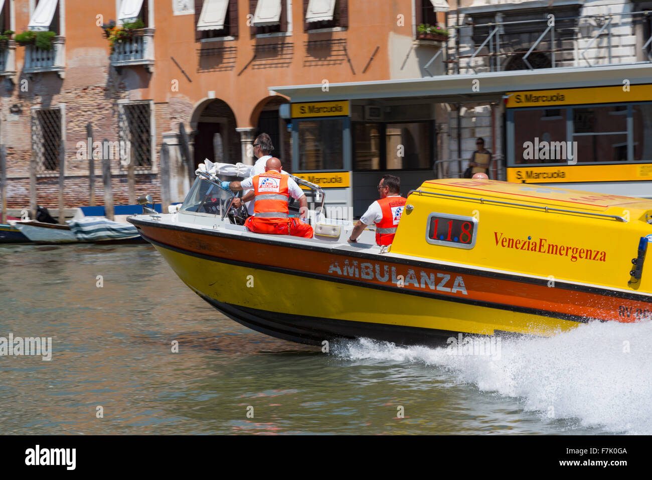 Venice, Italy.  A ambulance with medical personnel aboard powers its way at high speed down the Grand Canal. Stock Photo