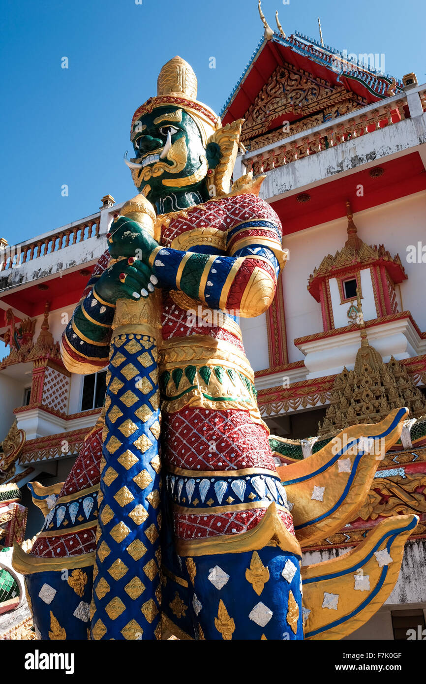 Green giant statue guarding Thai temple Stock Photo
