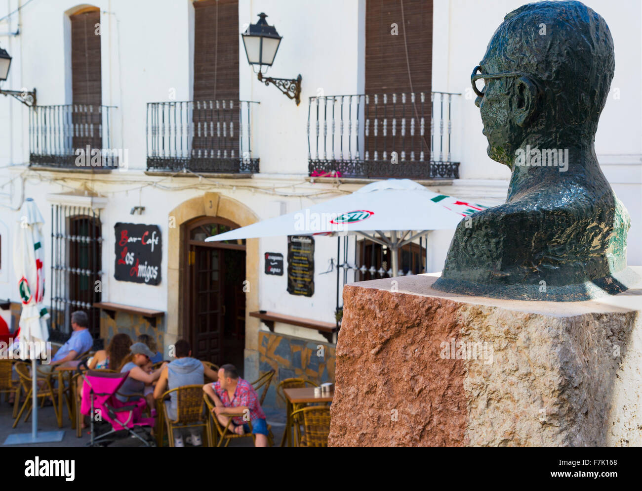 Casares, Malaga Province, Andalusia, southern Spain.  A bust of Blas Infante looks out over bar life in the Plaza de España, the Stock Photo