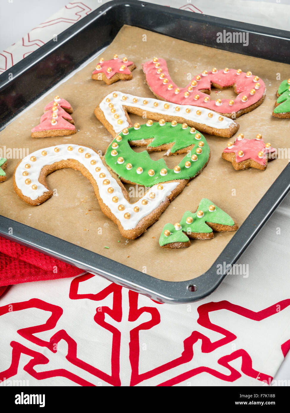 Home-made gingerbread cookies in shape of 2016 New Year digits on baking tray Stock Photo