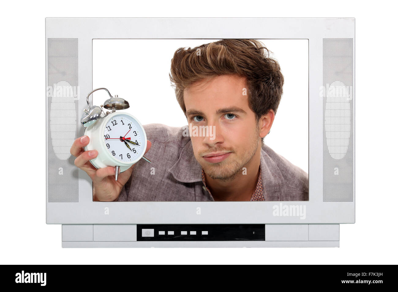 Man holding alarm clock trapped in the television Stock Photo Alamy
