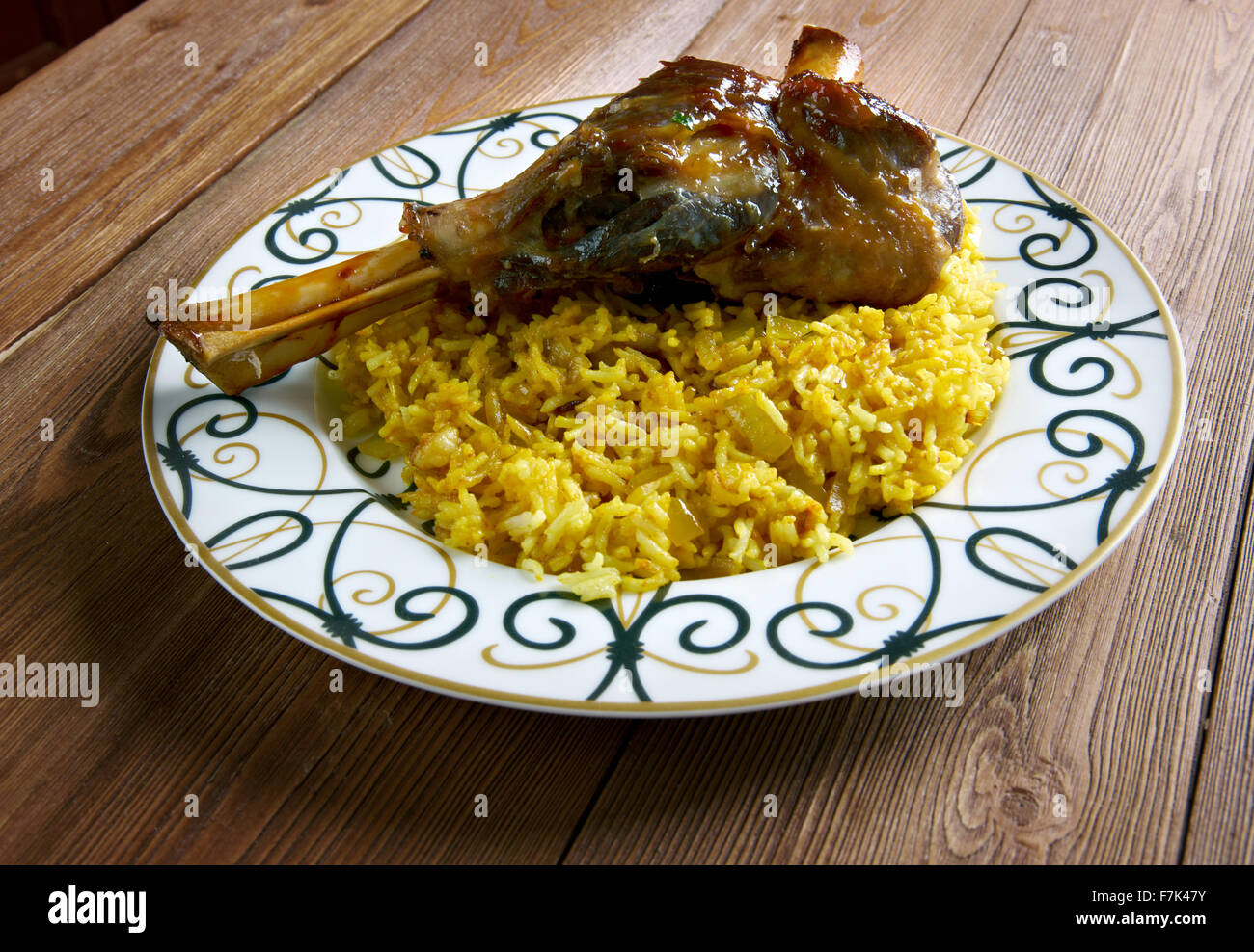 Indianspiced leg of lamb with pilau rice Stock Photo Alamy