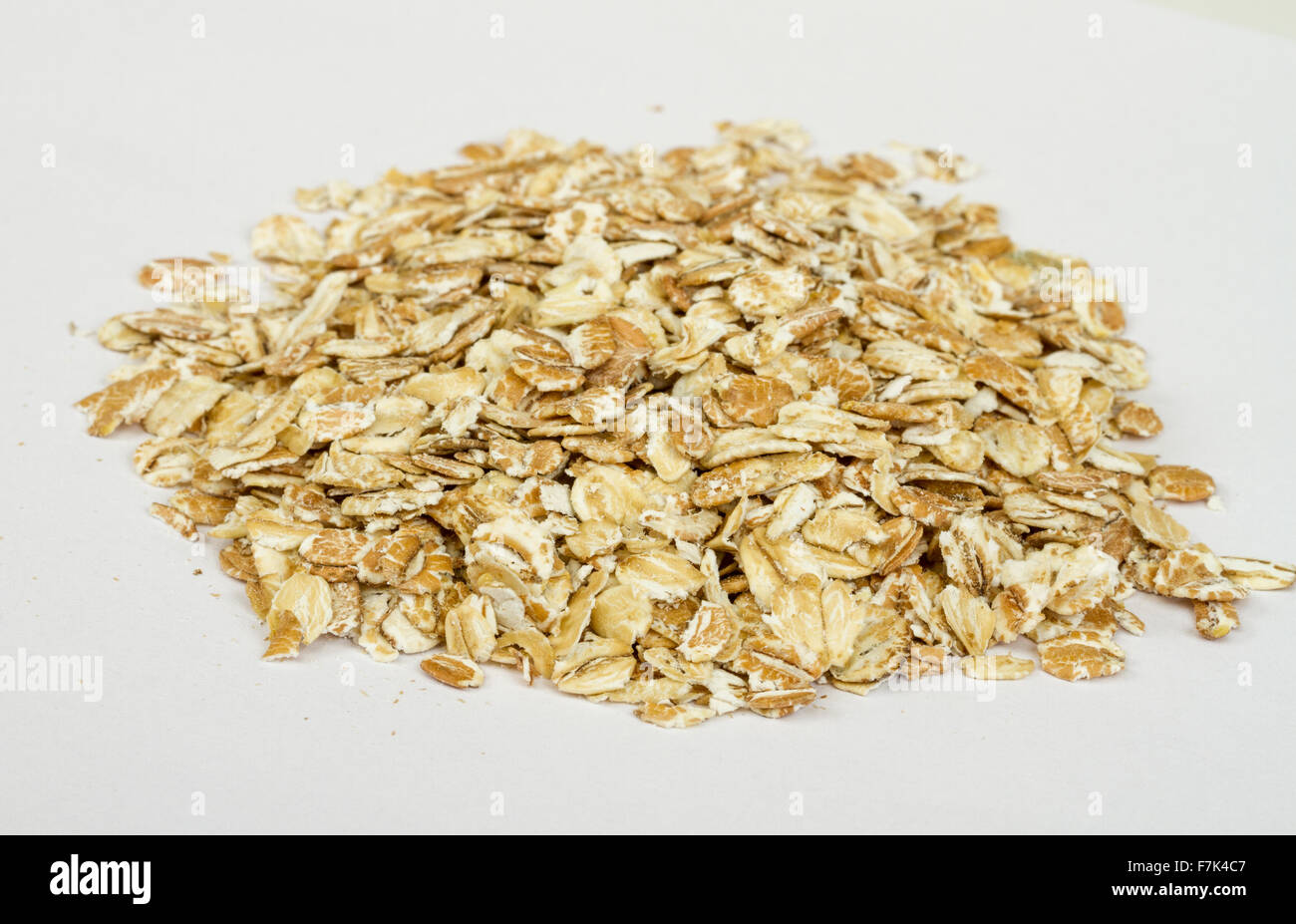 Heap of dry rolled oats isolated on white background Stock Photo Alamy