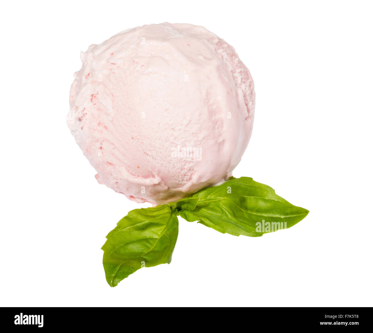 Scoop of strawberry ice cream from top on white background with mint ...