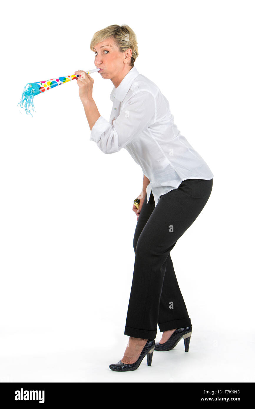 manager woman blowing through a toy trumpet Stock Photo