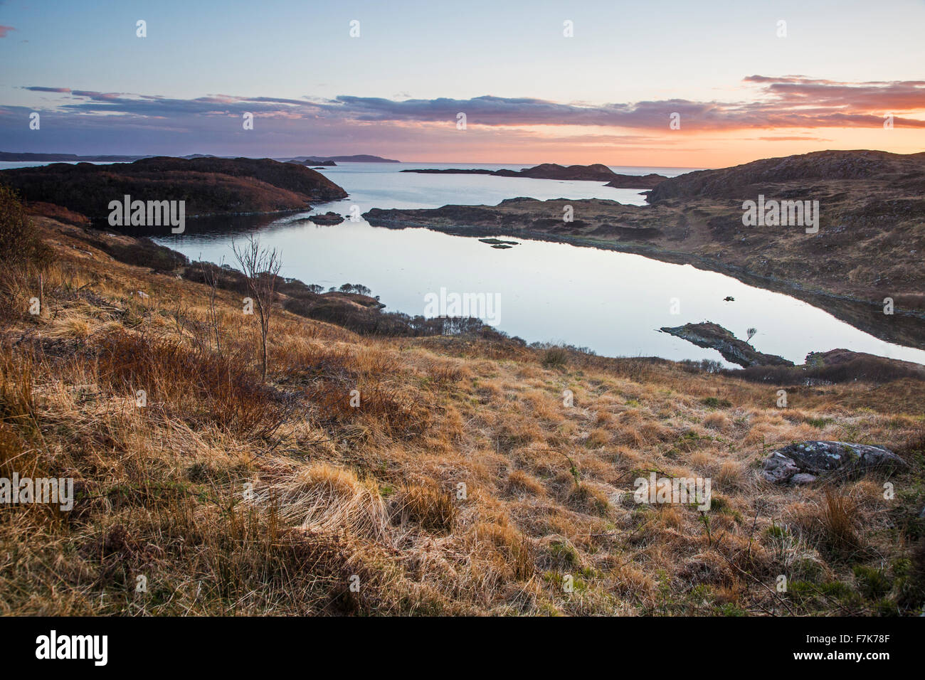 Tranquil ocean bay at sunset, Scotland Stock Photo