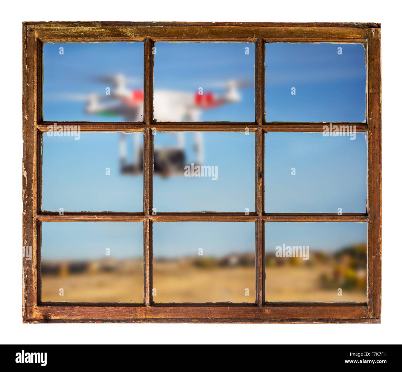 drones and privacy violation concept - blurred drone flying with a camera outside the window Stock Photo